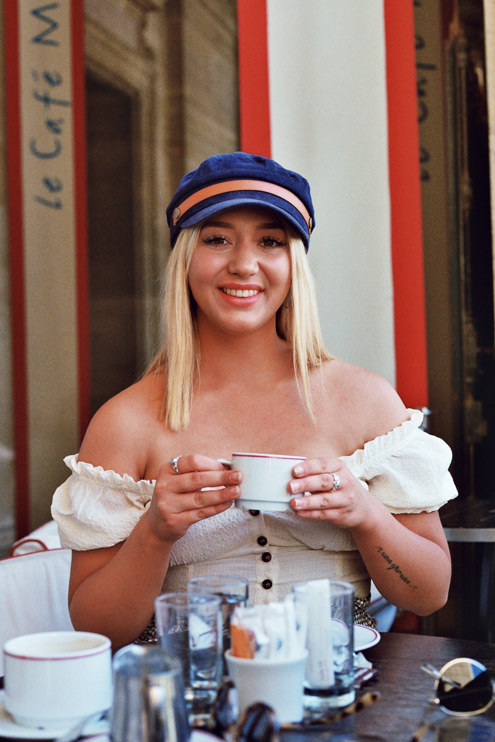 Analog Portrait of a woman in a Parisian cafe