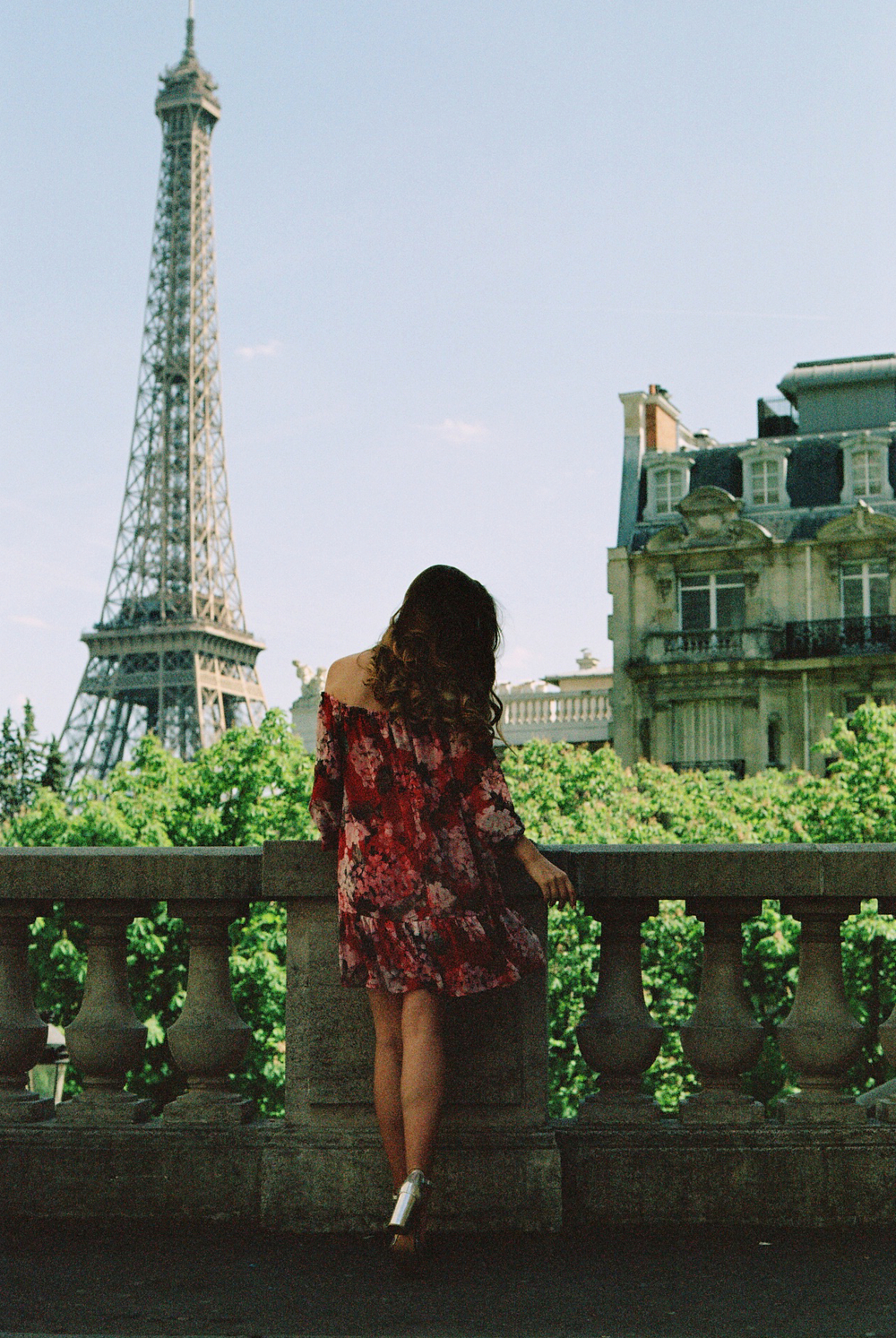 Film Photo of a Girl looking at the Eiffel Tower