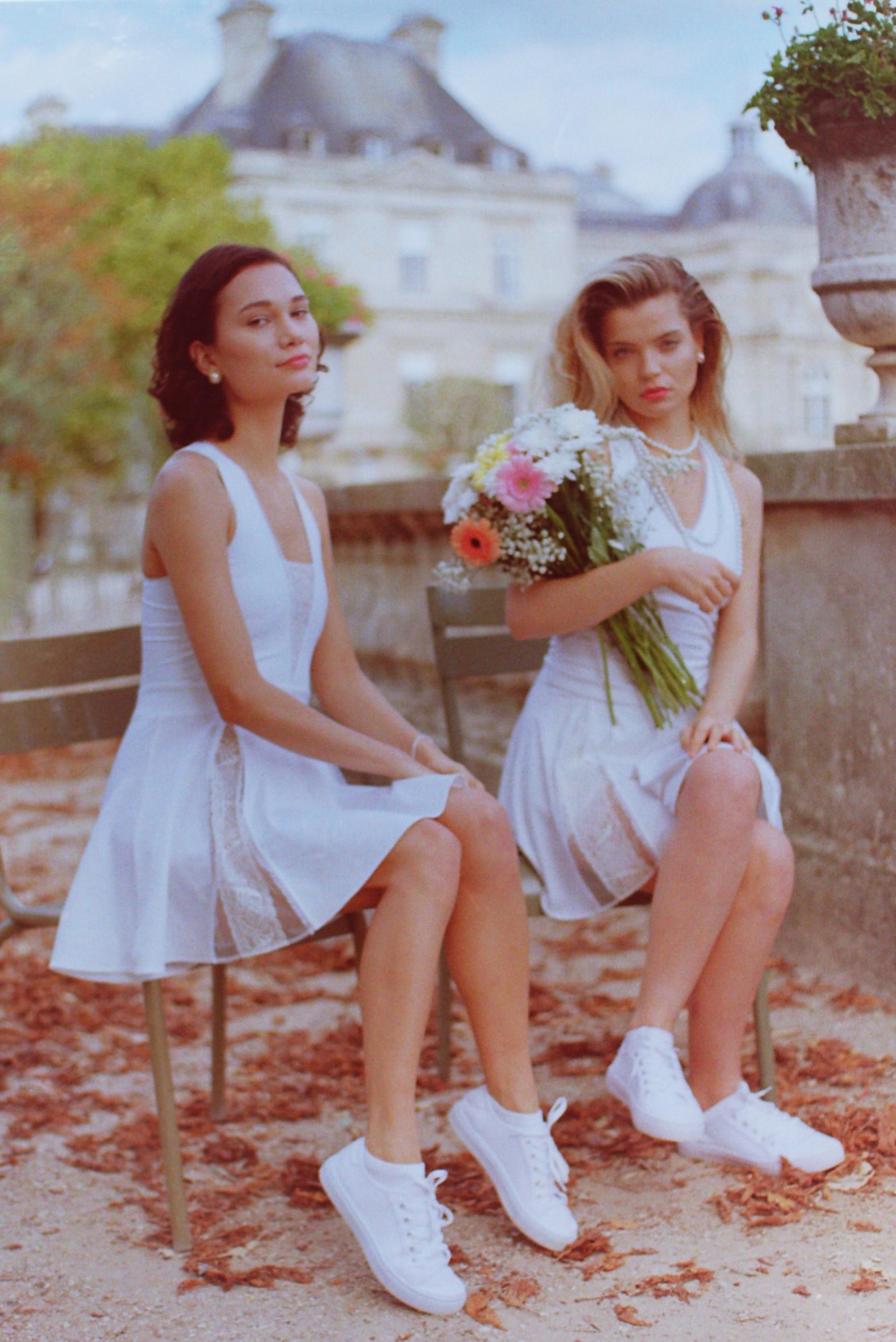 Blond and brunette models showcasing Thaber's vintage-inspired tennis wear, captured on film by Paris fashion photographer Anya Parsley