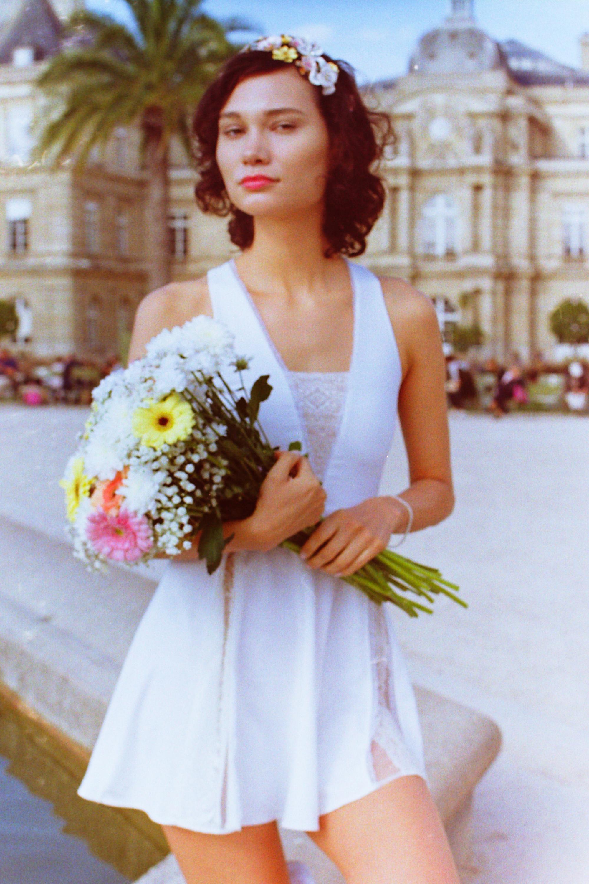 model Laurel, resembling Audrey Hepburn, showcasing Thaber's elegant designs in the Luxembourg Gardens, brand campaign by Paris fashion photographer Anya Parsley