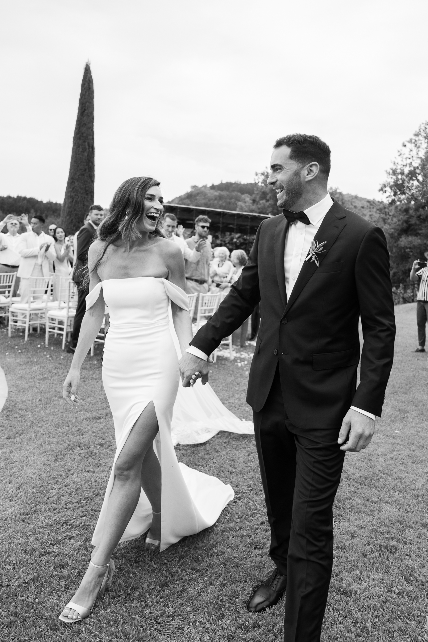 Amazing wedding couple walking down the aisle in Tuscany