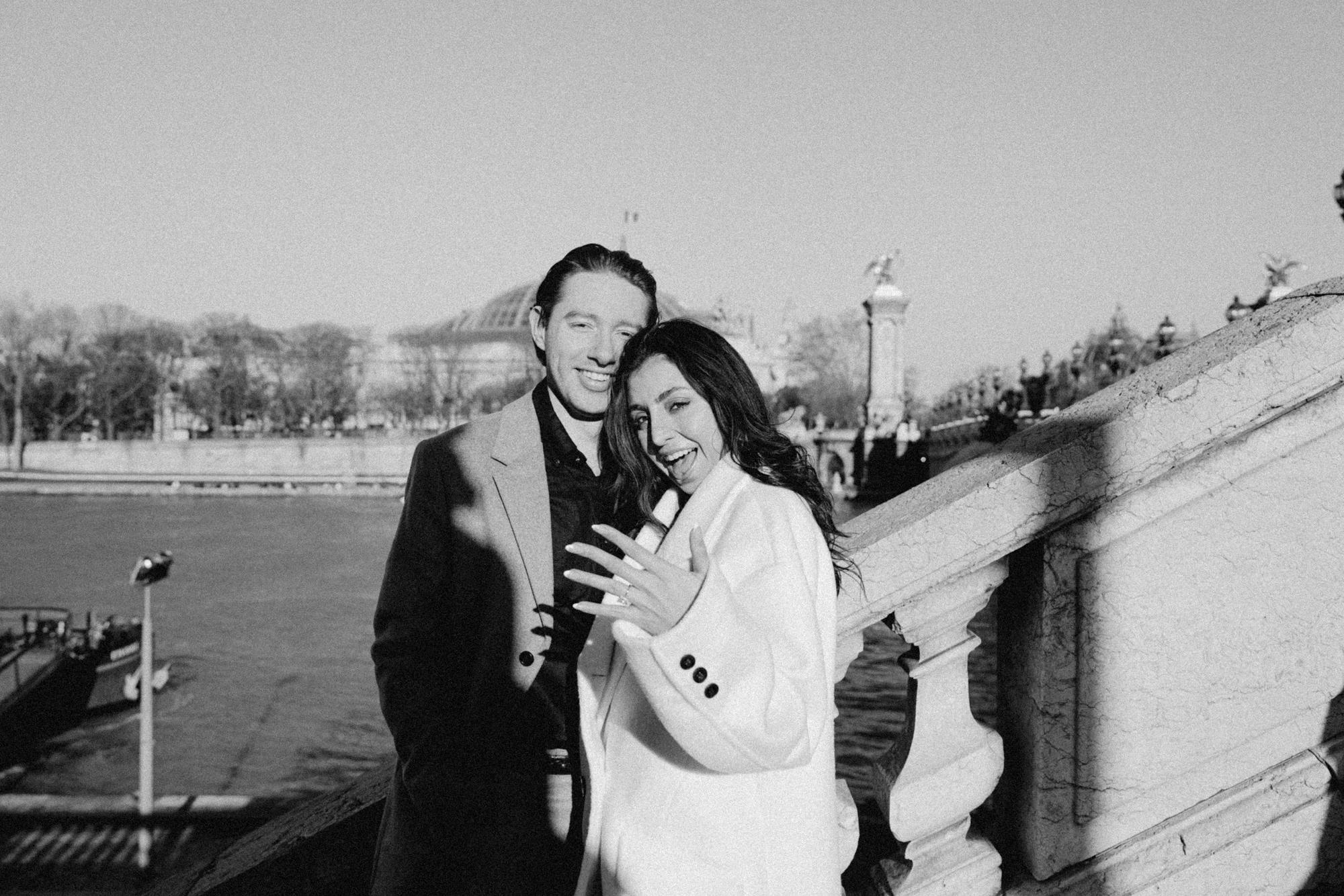 black and white photo of a newly engaged couple in Paris