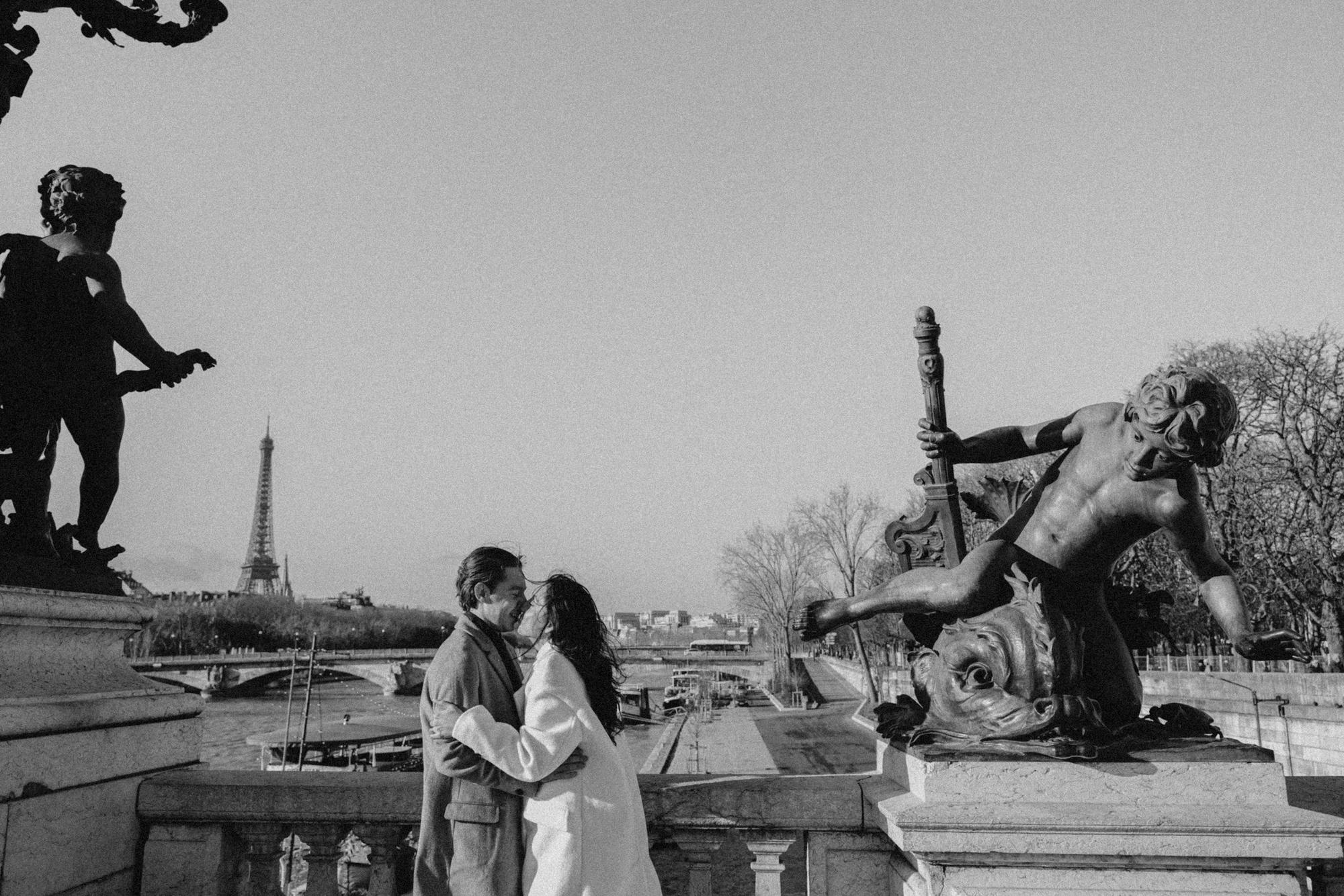 Artistic black and white engagement photo on the Bridge Alexandre III by Anya Parsley