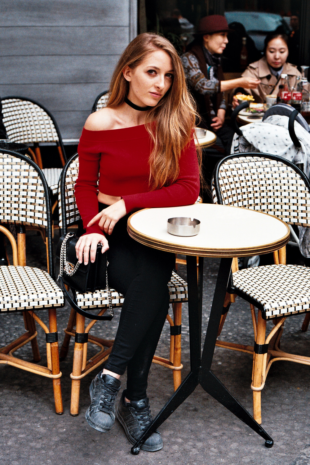 timeless candid shot of woman at a traditional Paris café in beret by Anya Parsley