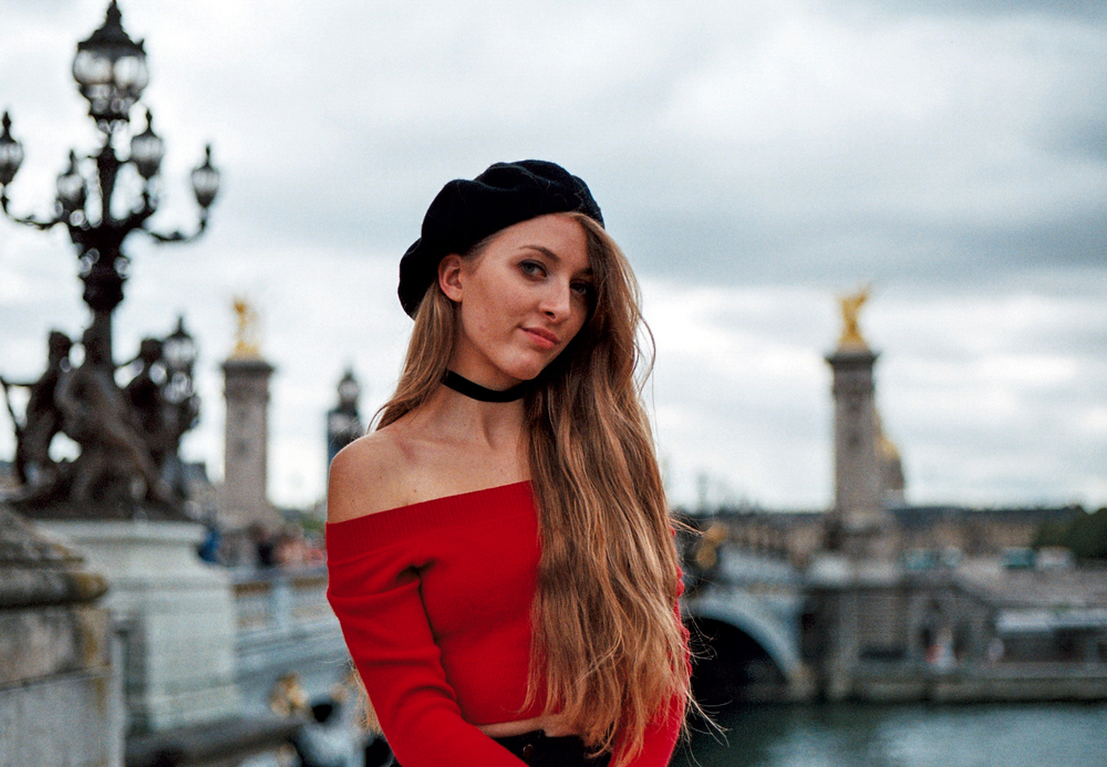 analog portrait of a woman wearing a beret on the Alexandre III bridge by photographer Anya Parsley