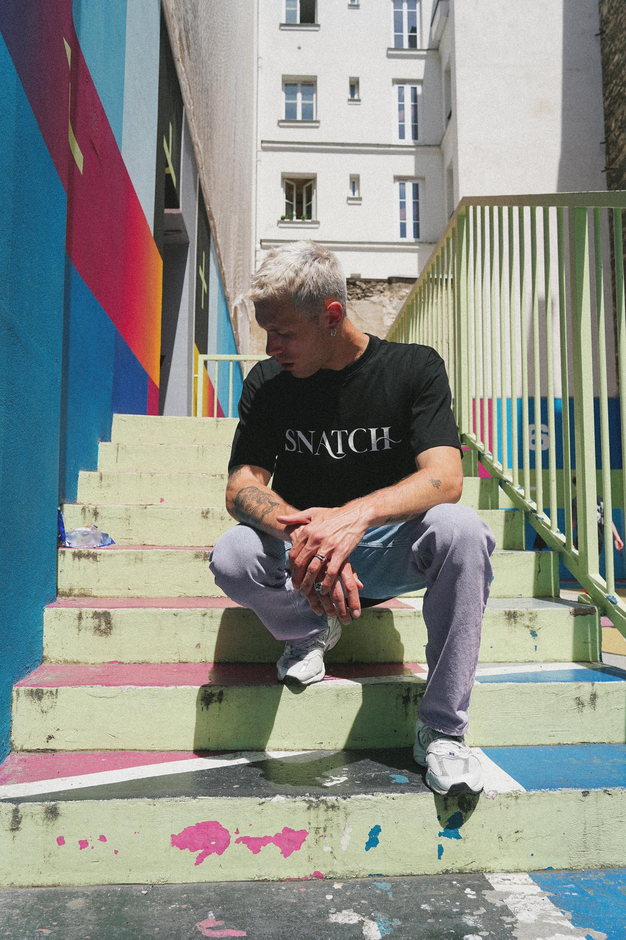 SNATCH streetwear captured at iconic Duperré basketball court by Paris street style fashion photographer 