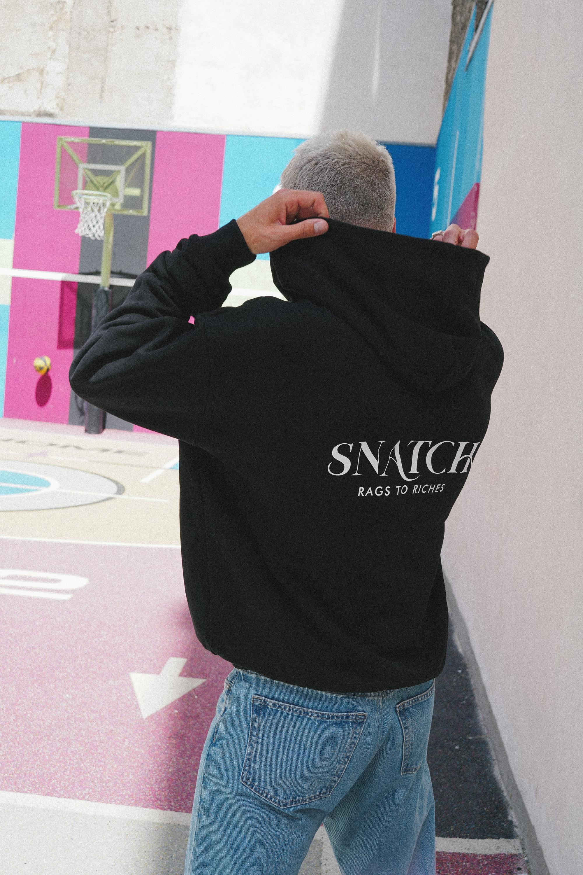 SNATCH streetwear displayed at iconic Duperré basketball court in street style Paris shoot
