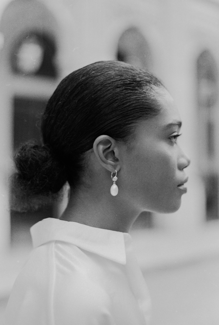 Detail shot of Gina Gant Pearls earrings in a lookbook on black and white film, emphasizing texture and clarity