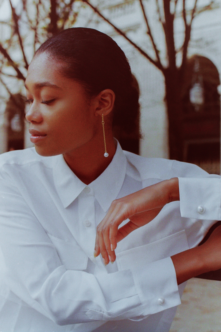 Elegant Film photograph of Gina Gant Pearls cufflinks on model's wrist by fashion photographer Anya Parsley