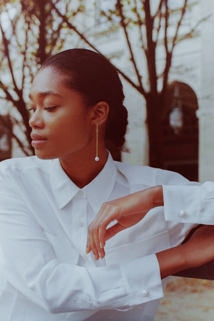 Timeless Film photograph of Pearls cufflinks on model's wrist by fashion photographer Anya Parsley