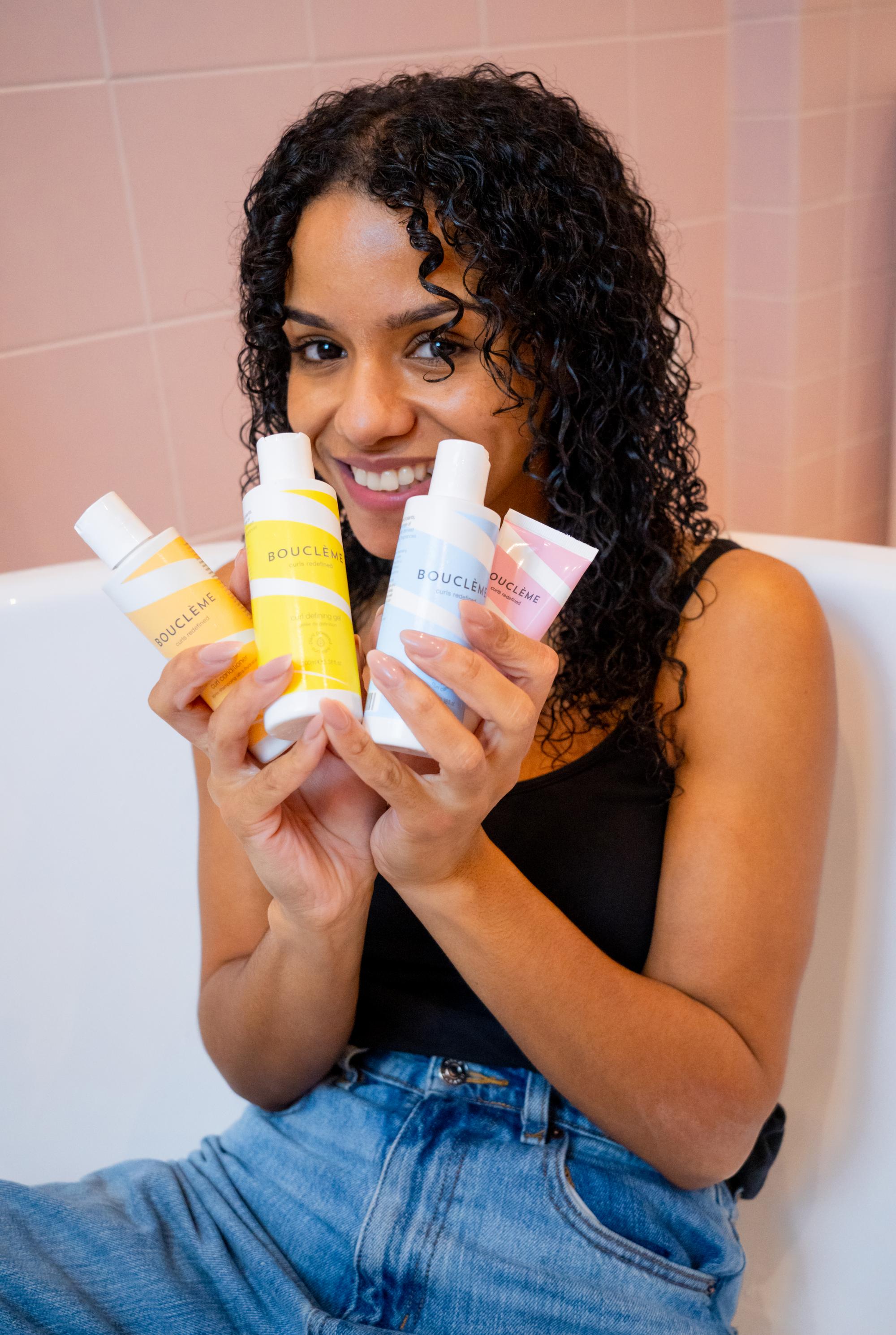 Model showing curly hair care products during commercial photoshoot in Paris by fashion photographer Anya Parsley