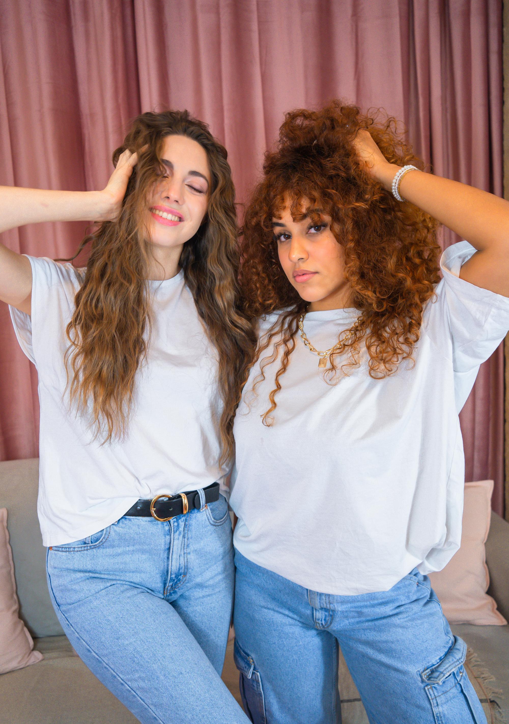 Paris fashion photographer captures influencer and model with curly hair for hair care brand campaign.