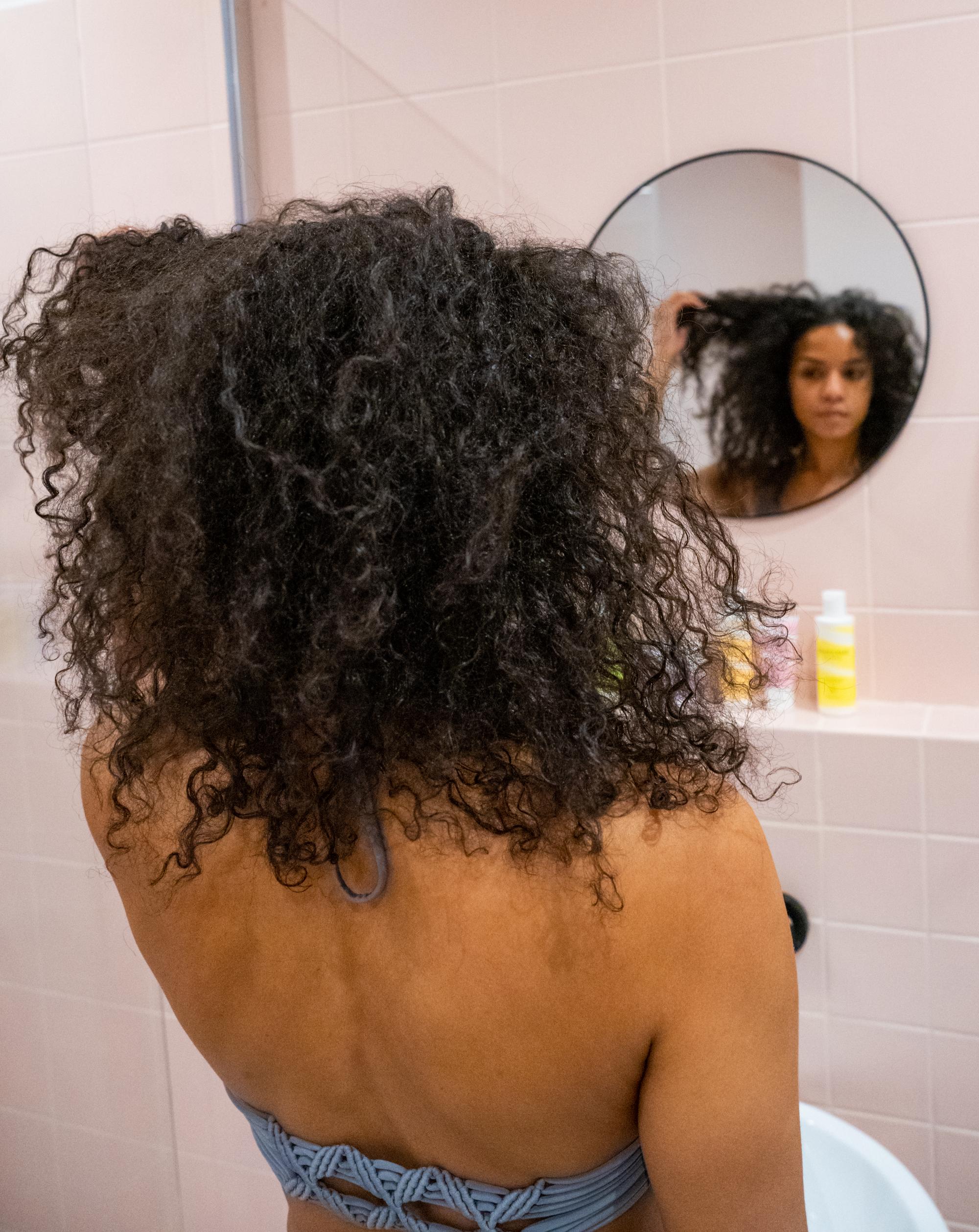 Before-and-after shots of curly hair transformation by Paris fashion photographer
