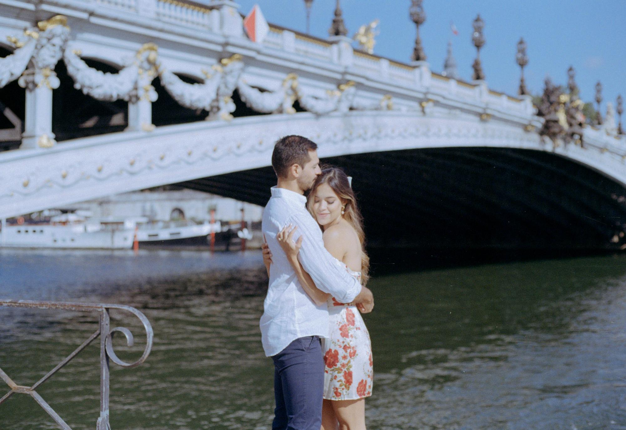 touching engagement photo session on film of a loving couple in Paris