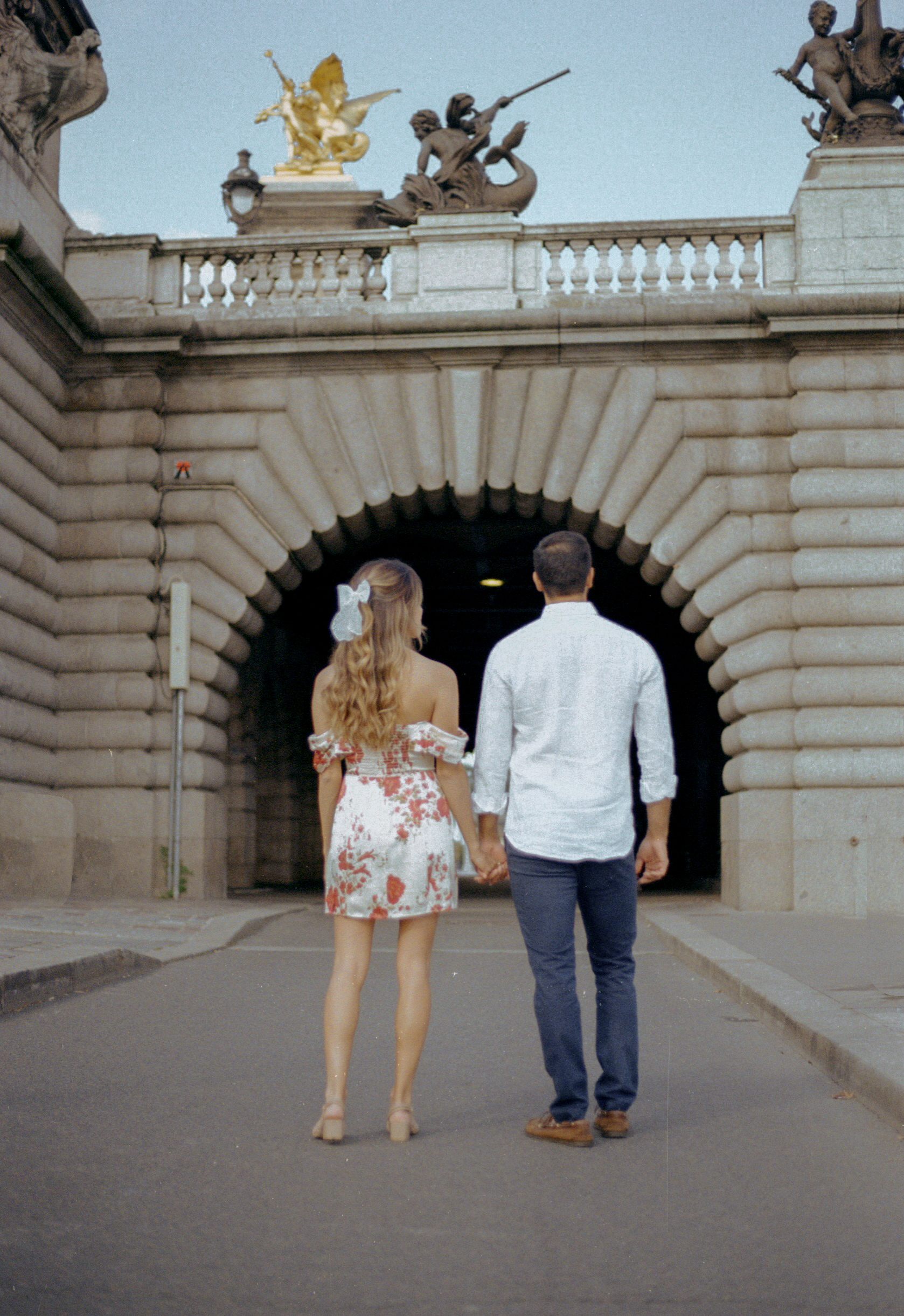 engagement shots of a couple in Paris taken on analog vintage film