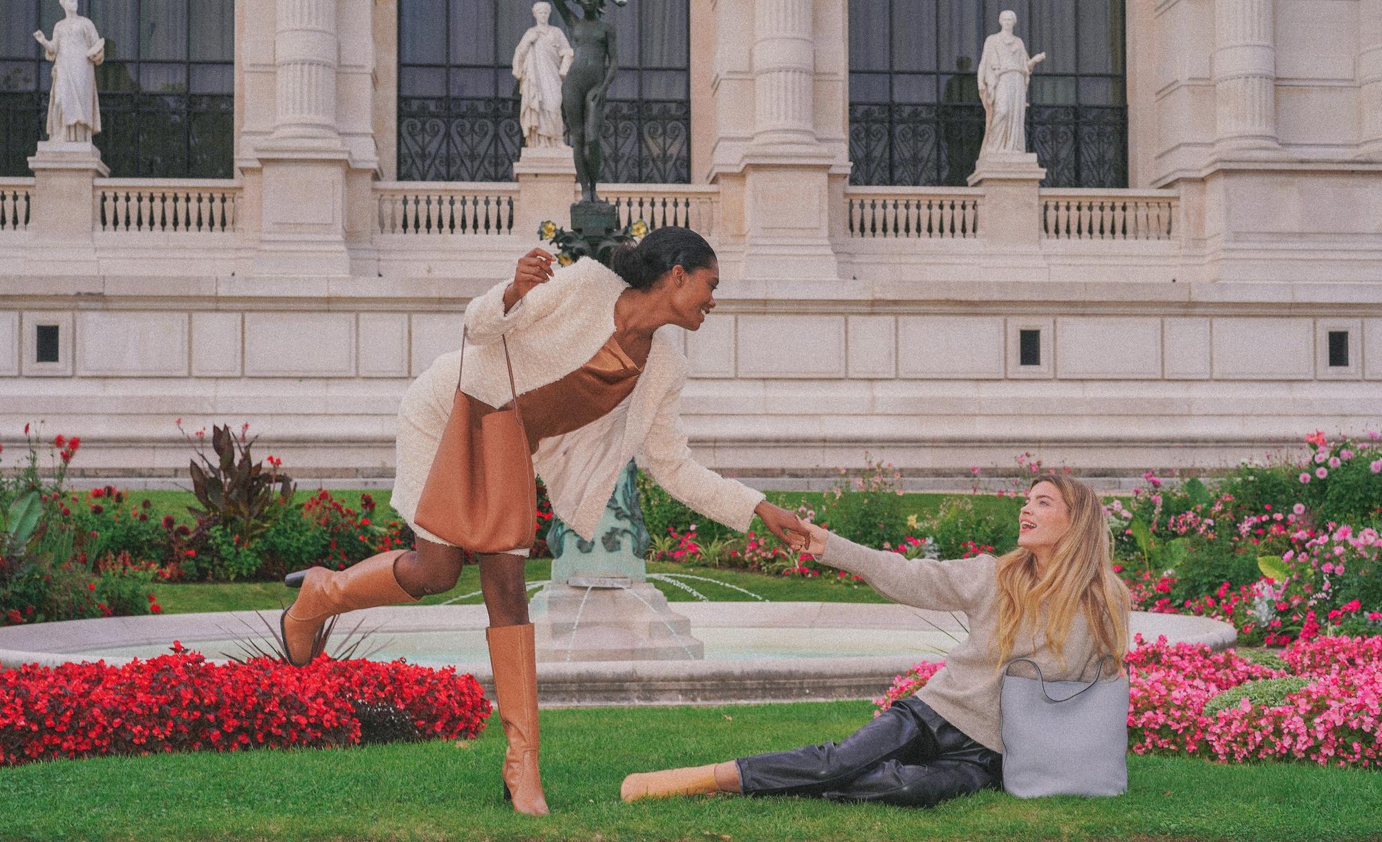 Paris fashion photographer creating playful visuals with H.Pai bags and two models.