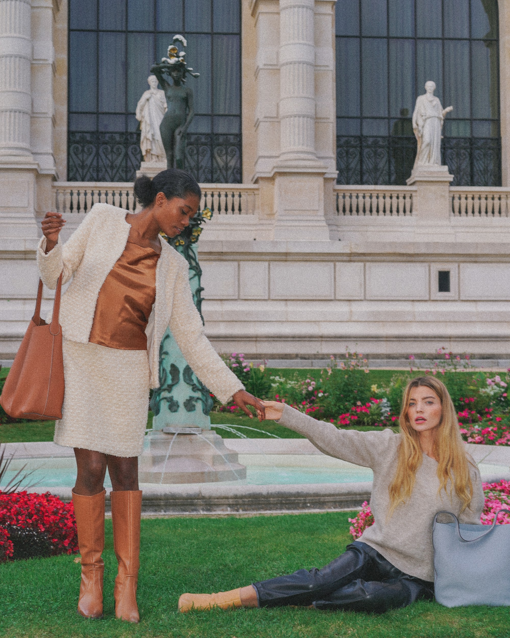 Models in a garden setting showcasing H.Pai bags.